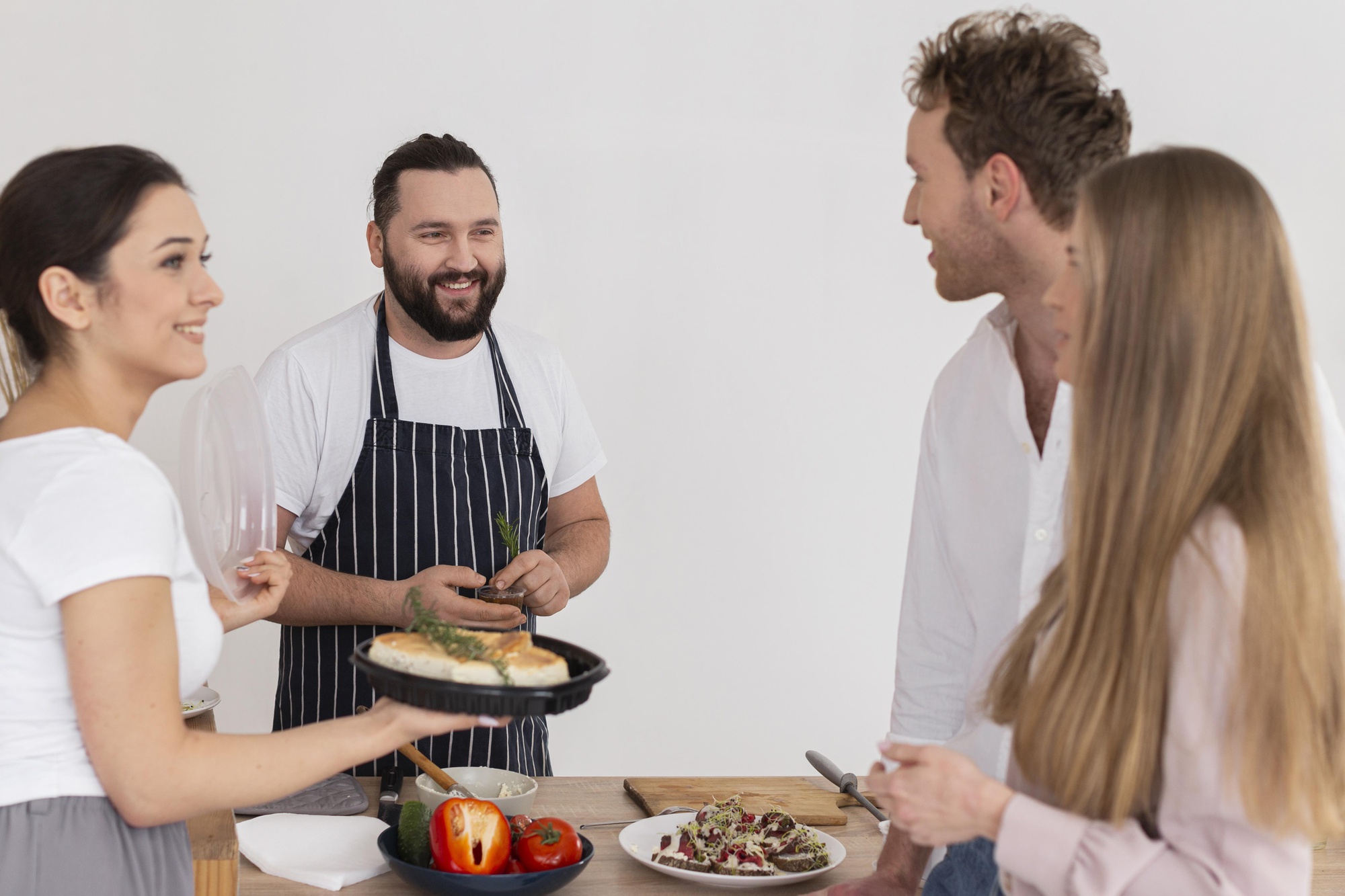 Workshop participants tasting prepared dishes